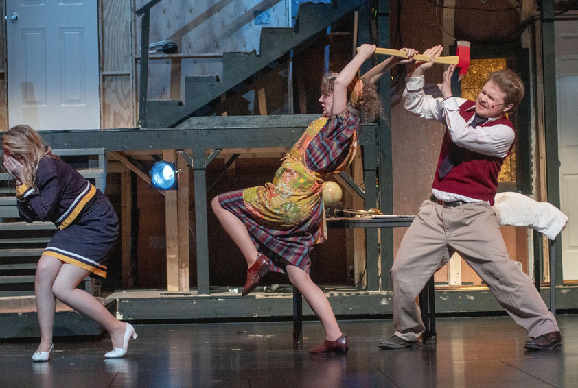 Theatre Production three actors on stage running to left in comic manner